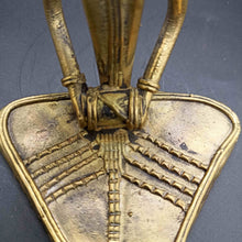 Dokra sitting musician with Dholak