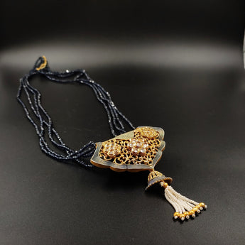 Black crystal beads necklace with ornate metal pendant